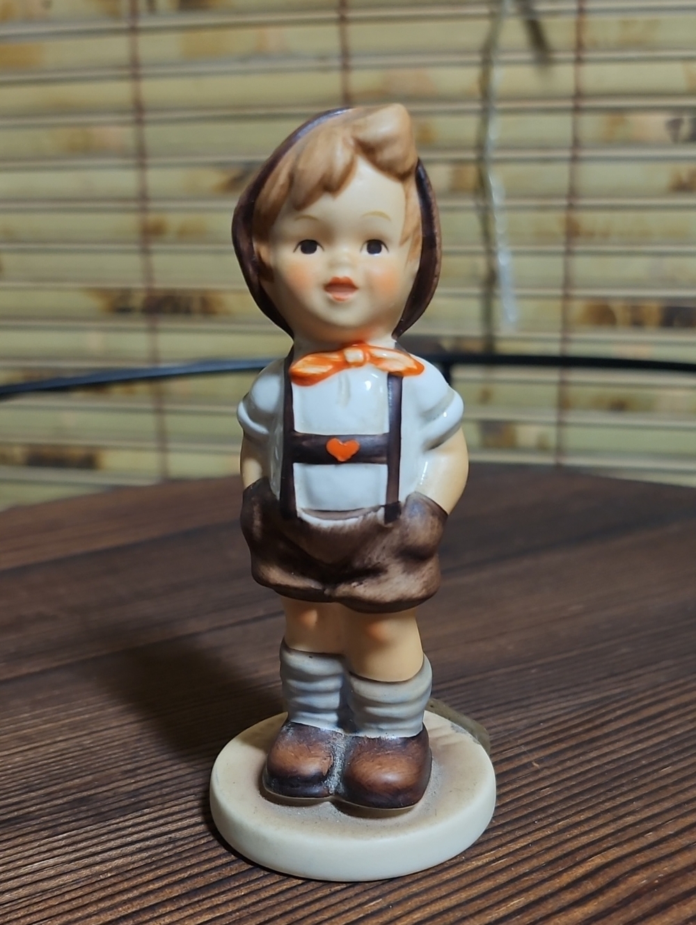 Hummel Boy Figurine in Brown, Cream and Orange Accents